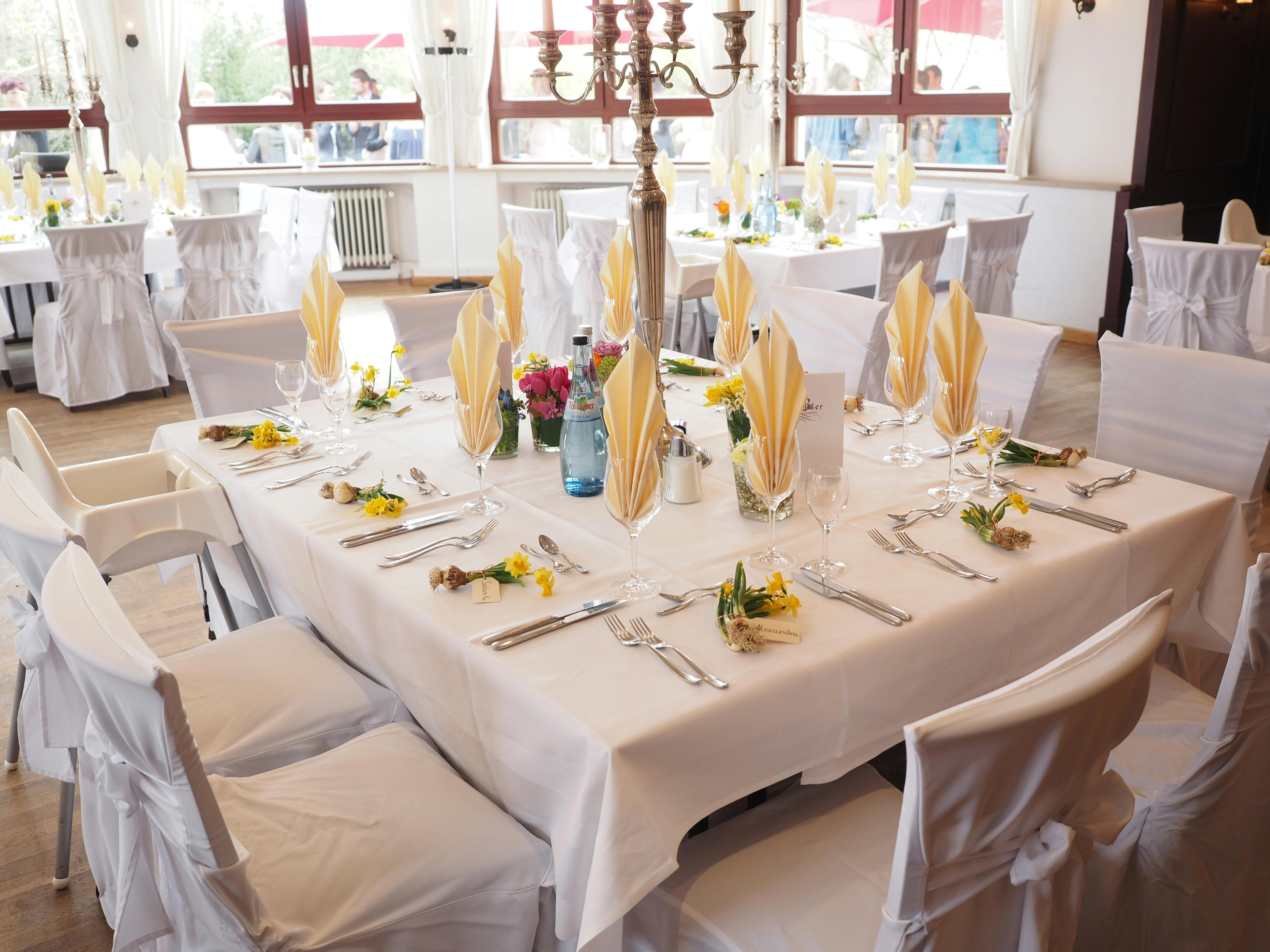 A beautifully decorated dining room table set for an elegant celebration indoors.